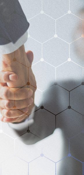 People shaking hands in business agreement background